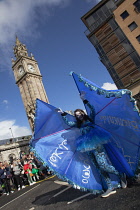 Ireland, North, Belfast, St Patricks Day parade passing the Albert clock on the corner of High Street and Victoria Street.