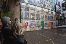 Ireland, North, Belfast, Cathedral Quarter, Decorated walls in Commercial Court.