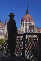 Hungary, Budapest, Statue of Imre Nagy, Communist Politician and reformer who was executed after the 1956 Revolution with Hungarian Parliament Building in the background.