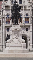 Hungary, Budapest, Statue of Count Gyula Andrássy, Hungary's Prime Minister between 1867 and 1871 with Hungarian Parliament Building behind.