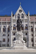 Hungary, Budapest, Statue of Count Gyula Andrássy, Hungary's Prime Minister between 1867 and 1871 with Hungarian Parliament Building behind.