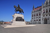 Hungary, Budapest, Statue of Count Gyula Andrássy, Hungary's Prime Minister between 1867 and 1871 with Hungarian Parliament Building behind.