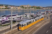 Hungary, Budapest, View from Elisabeth Bridge across the River Danube to Castle Hill with city tram No 2 in the foreground.