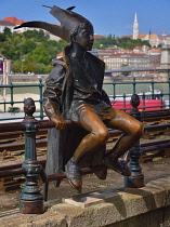 Hungary, Budapest, View across the Danube to Castle Hill with a statue of the Little Princess in the foreground.