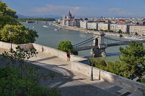 Hungary, Budapest, View across the River Danube to the Hungarian Parliament Building from Castle Hill with the Chain Bridge in the foreground.