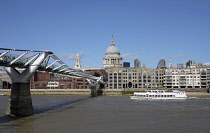 England, London,  Millennium bridge across river Thames toward  St Paul's Cathedral.