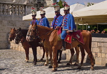 Hungary, Budapest, Hungarian Hussars Traditional Group in uniform on horseback at Buda Castle posing as a tourist attraction.