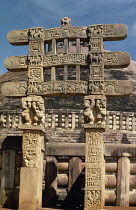 India, Madhya Pradesh, Sanchi, Front face of Western gateway with the architraves supported by dwarfs and depicting scenes from the life of Buddha.