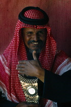 Qatar, General, Portrait of a Bedouin man in a tent.