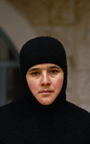Qatar, General, Portrait of woman wearing black head covering but with face exposed.