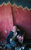 Qatar, General, Bedouin tent interior with girl.