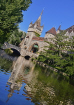 Hungary, Budapest, Vajdahunyad Castle, entrance gate to the castle over a small stream.