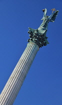 Hungary, Budapest, Heroes Square, The Millennium Monument with Archangel Gabriel on top.