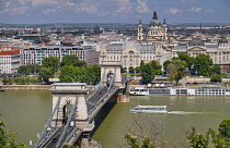 Hungary, Budapest, Szechenyi Chain Bridge across the River Danube with St Stephens Basilica as seen from Castle Hill.