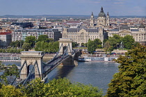 Hungary, Budapest, Szechenyi Chain Bridge across the River Danube with St Stephens Basilica as seen from Castle Hill.