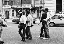 England, London, Gay Pride Parade, Piccadilly, Metropolitan Police Constable, gay couples.