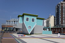 England, East Sussex, Brighton, Upside down house visitor attraction on the seafront.