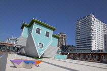 England, East Sussex, Brighton, Upside down house visitor attraction on the seafront.