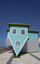 England, East Sussex, Brighton, Upside down house visitor attraction on the seafront.