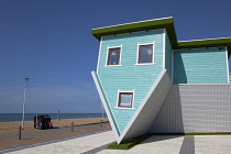 England, East Sussex, Brighton, Upside down house visitor attraction on the seafront.