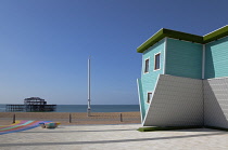 England, East Sussex, Brighton, Upside down house visitor attraction on the seafront opposite the ruins of the West Pier.