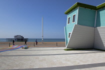 England, East Sussex, Brighton, Upside down house visitor attraction on the seafront opposite the ruins of the West Pier.