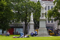 Ireland, North, Belfast, People relaxing on the City Hall lawns in summer.