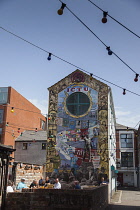 Ireland, North, Belfast, Cathedral Quarter, Colourfiul mural behind the John Hewitt pub.