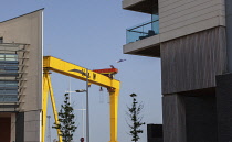 Ireland, North, Belfast, Titanic Quarter, Modern apartment buildings with Harland and Wolff cranes in the background.
