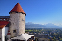 Slovenia, Upper Carniola, Bled, A tower of Bled Castle with the Karavanke Mountains in the background.