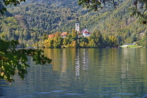 Slovenia, Upper Carniola, Bled, Distant view of Bled Island from the circular walk around Lake Bled.