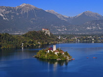 Slovenia, Upper Carniola, Bled, Lake Bled and Bled Island from the Osojnica Viewpoint with Bled Castle in the background.