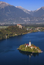 Slovenia, Upper Carniola, Bled, Lake Bled and Bled Island from the Osojnica Viewpoint with Bled Castle in the background.