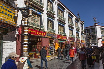 Buildings along one of the pedestrian streets of the circumambulation or kora route around the Jokhang Temple in Lhasa, Tibet.