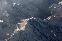 The Hengduan Mountains separate  the Tibetan Plateau from the Yunnan-Guizhou Plateau in western China in the region historically called Kham and is the home of the Khampa  or Khamba Tibetan people.  Aerial view between Chengdu, China and Lhasa, Tibet.