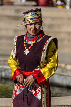 A Tibetan woman in festive dress in Lhasa, Tibet.