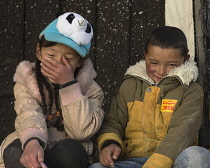 Tibetan children posing for a portrait in Lhasa, Tibet.