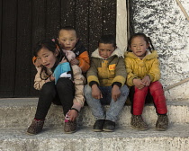 Tibetan children posing for a portrait in Lhasa, Tibet.