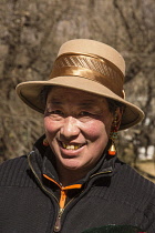 A Khamba Tibetan woman from the Kham region of eastern Tibet on a pilgrimage to visit holy sites in Lhasa, Tibet.