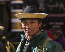 A Tibetan Buddhist pilgrim from the Kham region of eastern Tibet circumambulating around the Jokhang Temple in Lhasa, Tibet.