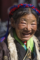An older woman traditional dress in Lhasa, Tibet.