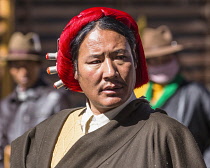 A Tibetan Buddhist pilgrim from the Kham region of eastern Tibet circumambulating around the Jokhang Temple in Lhasa, Tibet.