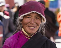 An older woman traditional dress in Lhasa, Tibet.