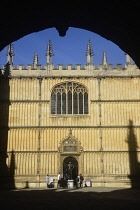 England, Oxford, Bodleian library through arched entrance..