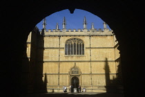 England, Oxford, Bodleian library through arched entrance..