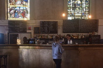 England, Oxford, Freud bar/nightclub, interior of bar with old stained glass window..