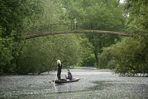 England, Oxford, Punting on the River Cherwell at University Parks with High Bridge.