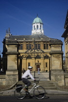 England, Oxford, Sheldonian Theatre with cyclist.