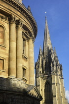 England, Oxford, church tower and Radcliffe Camera, St Mary the Virgin Church.