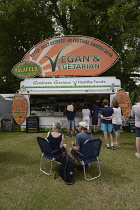 Food, Catering, Vegan food stall at outdoor festival.